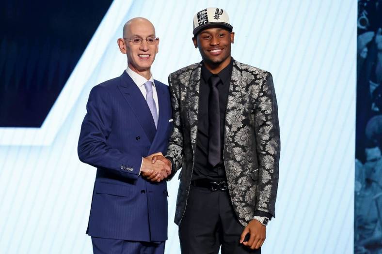 Jun 23, 2022; Brooklyn, NY, USA; Malaki Branham (Ohio State) shakes hands with NBA commissioner Adam Silver after being selected as the number twenty overall pick by the San Antonio Spurs in the first round of the 2022 NBA Draft at Barclays Center. Mandatory Credit: Brad Penner-USA TODAY Sports