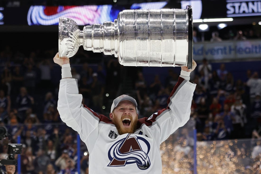 Jun 26, 2022; Tampa, Florida, USA; Colorado Avalanche left wing Gabriel Landeskog (92) celebrates with the Stanley Cup after the game against the Tampa Bay Lightning in game six of the 2022 Stanley Cup Final at Amalie Arena. Mandatory Credit: Geoff Burke-USA TODAY Sports