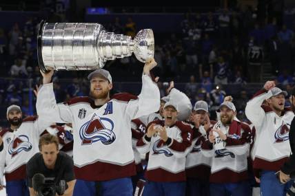 Jun 26, 2022; Tampa, Florida, USA; Colorado Avalanche center Nathan MacKinnon (29) celebrates with the Stanley Cup after the Avalanche game against the Tampa Bay Lightning in game six of the 2022 Stanley Cup Final at Amalie Arena. Mandatory Credit: Geoff Burke-USA TODAY Sports