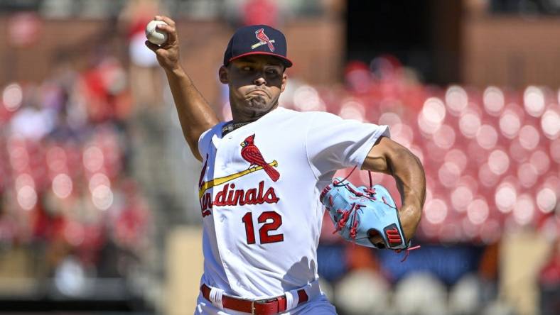 Jul 10, 2022; St. Louis, Missouri, USA;  St. Louis Cardinals relief pitcher Jordan Hicks (12) pitches against the Philadelphia Phillies during the eighth inning at Busch Stadium. Mandatory Credit: Jeff Curry-USA TODAY Sports