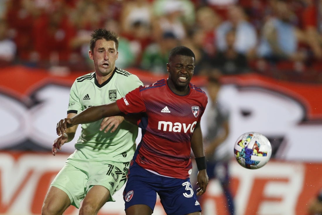 Jul 16, 2022; Frisco, Texas, USA; Austin FC midfielder Ethan Finlay (13) and FC Dallas defender Nan   (31) fight for a ball in the second half at Toyota Stadium. Mandatory Credit: Tim Heitman-USA TODAY Sports