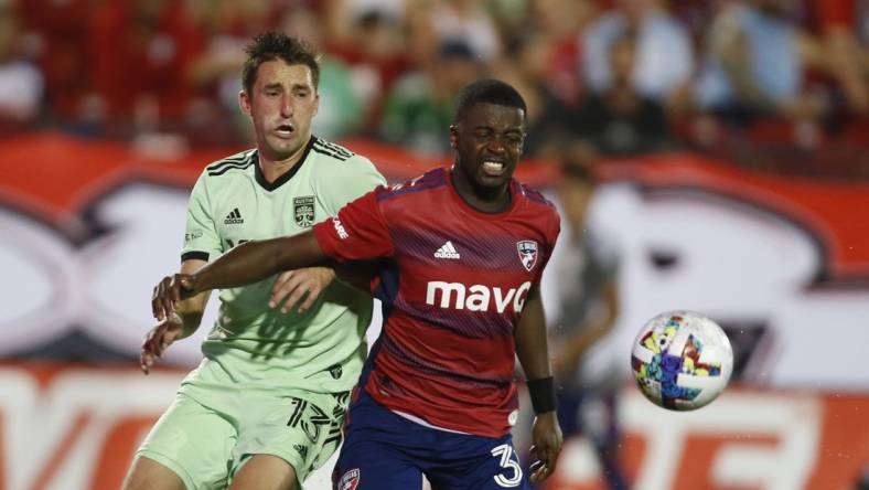 Jul 16, 2022; Frisco, Texas, USA; Austin FC midfielder Ethan Finlay (13) and FC Dallas defender Nan   (31) fight for a ball in the second half at Toyota Stadium. Mandatory Credit: Tim Heitman-USA TODAY Sports