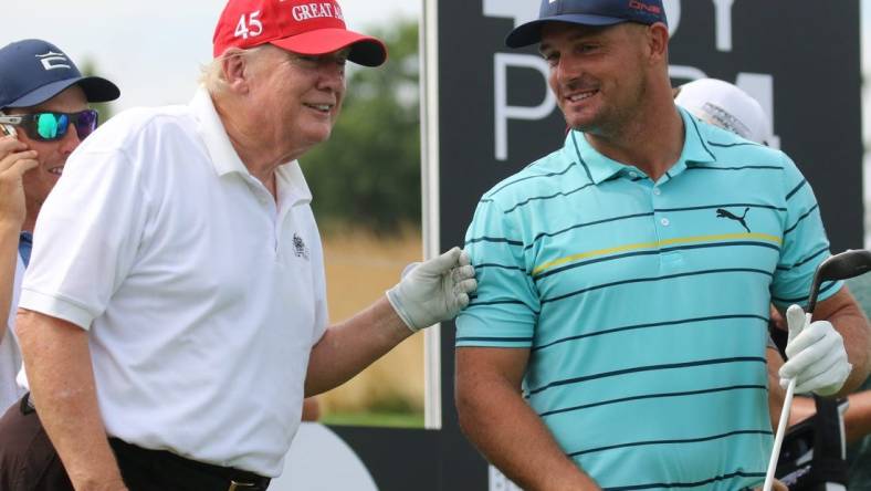 July 28, 2022; Bedminster, NJ, USA; Donald Trump with Bryson DeChambeau during the Pro Am. The LIV Pro Am Tournament featured the former President of the United States, Donald Trump and his son Eric Trump playing with with Dustin Johnson and Bryson DeChambeau at Trump National in Bedminster, NJ on July 28, 2022. Mandatory Credit: Chris Pedota-USA TODAY NETWORK