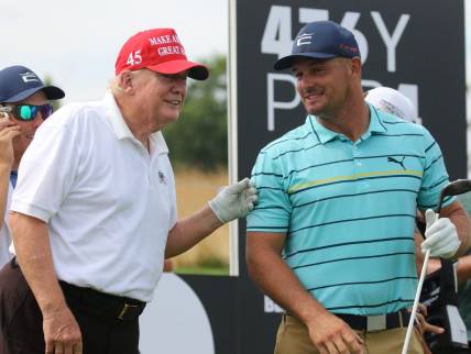 July 28, 2022; Bedminster, NJ, USA; Donald Trump with Bryson DeChambeau during the Pro Am. The LIV Pro Am Tournament featured the former President of the United States, Donald Trump and his son Eric Trump playing with with Dustin Johnson and Bryson DeChambeau at Trump National in Bedminster, NJ on July 28, 2022. Mandatory Credit: Chris Pedota-USA TODAY NETWORK
