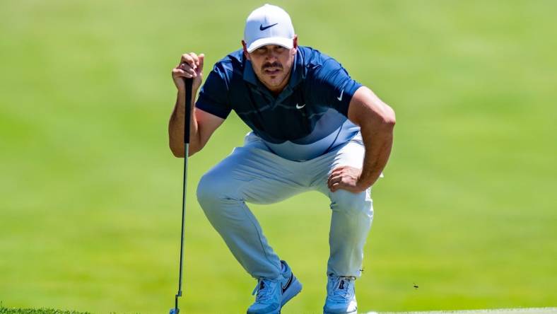 Jul 30, 2022; Bedminster, New Jersey, USA; Brooks Koepka lines up a putt on the 3rd green during the second round of a LIV Golf tournament at Trump National Golf Club Bedminster. Mandatory Credit: John Jones-USA TODAY Sports