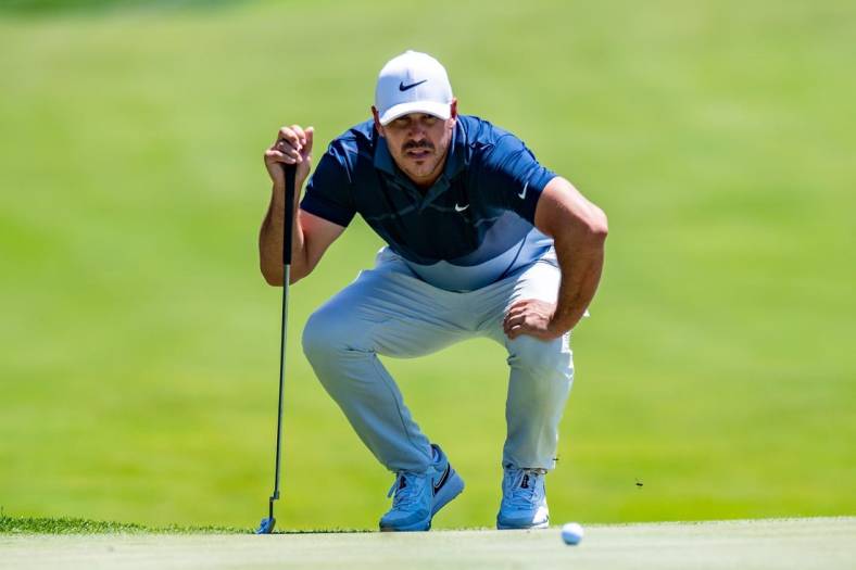 Jul 30, 2022; Bedminster, New Jersey, USA; Brooks Koepka lines up a putt on the 3rd green during the second round of a LIV Golf tournament at Trump National Golf Club Bedminster. Mandatory Credit: John Jones-USA TODAY Sports