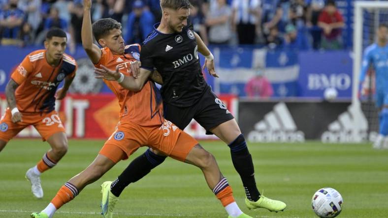 Jul 30, 2022; Montreal, Quebec, CAN; New York City FC midfielder Gabriel Pereira dos Santos (38) and CF Montreal midfielder Djordje Mihailovic (8) battle for the ball during the first half at Stade Saputo. Mandatory Credit: Eric Bolte-USA TODAY Sports