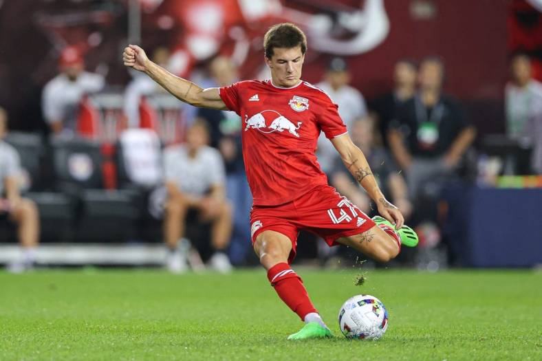 Aug 2, 2022; Harrison, New Jersey, USA; New York Red Bulls defender John Tolkin (47) kicks the ball against the Colorado Rapids during the second half at Red Bull Arena. Mandatory Credit: Vincent Carchietta-USA TODAY Sports