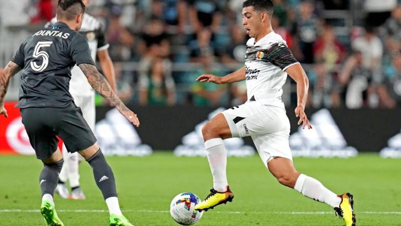 Aug 10, 2022; Saint Paul, MN, USA; Liga MX midfielder Erik Lira (6) of Cruz Azul moves the ball against MLS forward Taxiarchis Fountas (5) of DC United during the MLS All-Star Game at Allianz Field. Mandatory Credit: John David Mercer-USA TODAY Sports