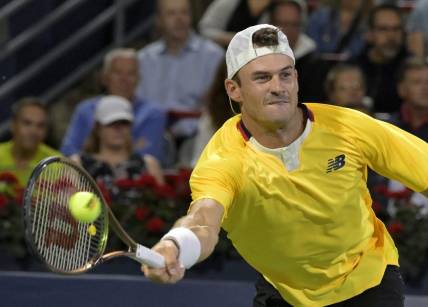 Aug 12, 2022; Montreal, QC, Canada; Tommy Paul (USA) hits a forehand against Daniel Evans (GBR) (not pictured) in quarterfinal play in the National Bank Open at IGA Stadium. Mandatory Credit: Eric Bolte-USA TODAY Sports