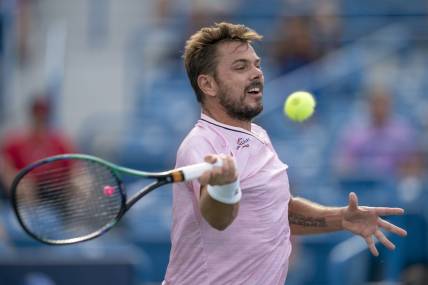 Aug 15, 2022; Cincinnati, OH, USA;  Stanislas Wawrinka (SUI) returns a shot during his match against Andy Murray (GBR) at the Western & Southern at the at the Lindner Family Tennis Center. Mandatory Credit: Susan Mullane-USA TODAY Sports