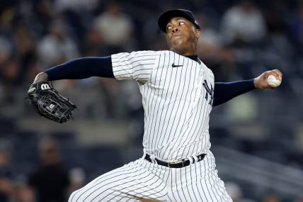 Aug 17, 2022; Bronx, New York, USA; New York Yankees relief pitcher Aroldis Chapman (54) pitches against the Tampa Bay Rays during the tenth inning at Yankee Stadium. Mandatory Credit: Brad Penner-USA TODAY Sports