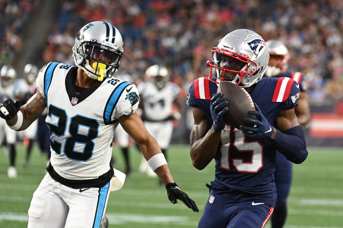 Aug 19, 2022; Foxborough, Massachusetts, USA; New England Patriots wide receiver Nelson Agholor (15) makes a catch with pressure from Carolina Panthers cornerback Keith Taylor Jr. (28) during the first half of a preseason game at Gillette Stadium. Mandatory Credit: Eric Canha-USA TODAY Sports