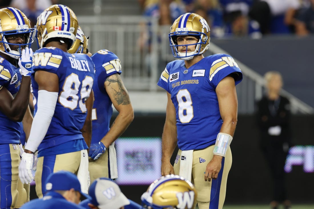 Aug 25, 2022; Winnipeg, Manitoba, CAN;  Winnipeg Blue Bombers quarterback Zach Collaros (8) reacts to an injured teammate during the second half against the Calgary Stampeders at IG Field. Winnipeg wins 31-29. Mandatory Credit: Bruce Fedyck-USA TODAY Sports