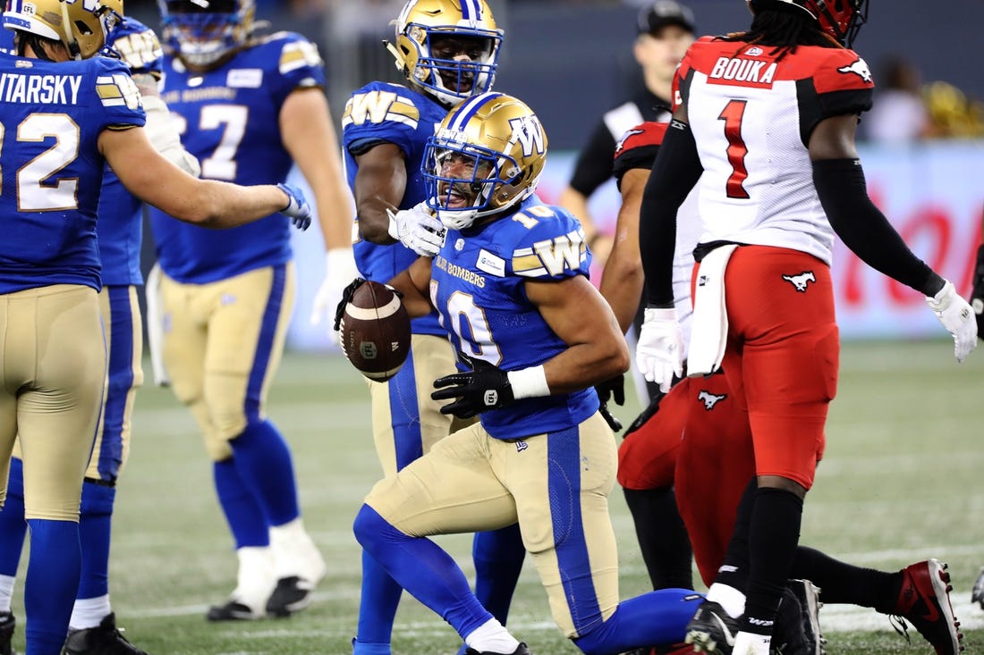 Aug 25, 2022; Winnipeg, Manitoba, CAN;  Winnipeg Blue Bombers wide receiver Nic Demski (10) celebrates after a run during the second half against the Calgary Stampeders at IG Field. Winnipeg wins 31-29. Mandatory Credit: Bruce Fedyck-USA TODAY Sports
