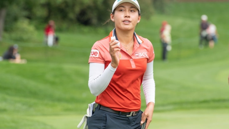 Aug 26, 2022; Ottawa, Ontario, CAN; Atthaya Thitikul from Thailand completes her 18th hole during the second round of the CP Women's Open golf tournament. Mandatory Credit: Marc DesRosiers-USA TODAY Sports