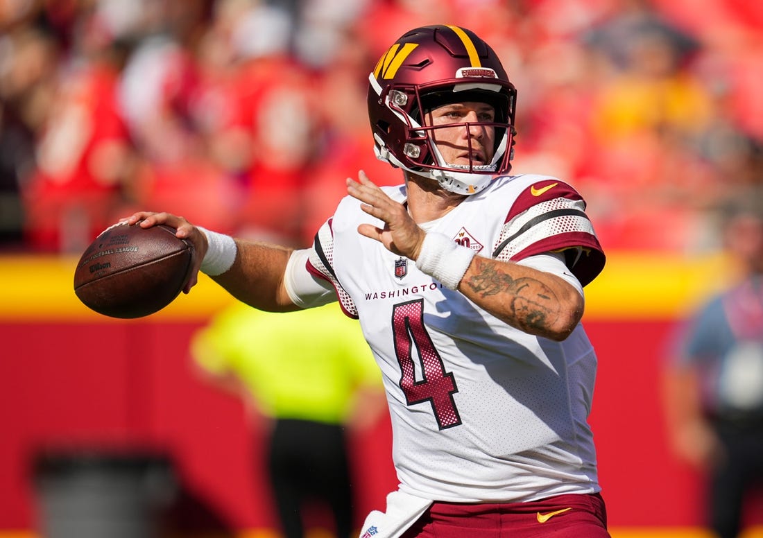 Aug 20, 2022; Kansas City, Missouri, USA; Washington Commanders quarterback Taylor Heinicke (4) throws a pass against the Kansas City Chiefs during the second half at GEHA Field at Arrowhead Stadium. Mandatory Credit: Jay Biggerstaff-USA TODAY Sports