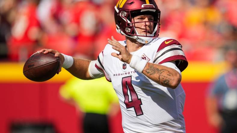 Aug 20, 2022; Kansas City, Missouri, USA; Washington Commanders quarterback Taylor Heinicke (4) throws a pass against the Kansas City Chiefs during the second half at GEHA Field at Arrowhead Stadium. Mandatory Credit: Jay Biggerstaff-USA TODAY Sports