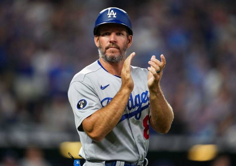 Aug 12, 2022; Kansas City, Missouri, USA; Los Angeles Dodgers first base coach Clayton McCullough (86) takes the field during the fifth inning against the Kansas City Royals at Kauffman Stadium. Mandatory Credit: Jay Biggerstaff-USA TODAY Sports