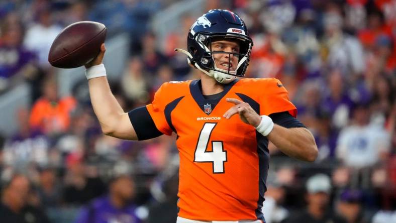 Aug 27, 2022; Denver, Colorado, USA; Denver Broncos quarterback Brett Rypien (4) prepares to pass the ball the ball in the first quarter against the Minnesota Vikings at Empower Field at Mile High. Mandatory Credit: Ron Chenoy-USA TODAY Sports