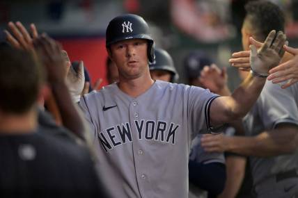 Aug 29, 2022; Anaheim, California, USA;  New York Yankees third baseman DJ LeMahieu (26) is greeted in the dugout after a sacrifice bunt scored a run in the fourth inning against the Los Angeles Angels at Angel Stadium. Mandatory Credit: Jayne Kamin-Oncea-USA TODAY Sports