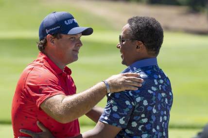 Sep 2, 2022; Boston, Massachusetts, USA; Patrick Reed (left) is greeted by LIV Golf Managing Director Majed Al Sorour before the start of the first round of the LIV Golf tournament  at The International. Mandatory Credit: Richard Cashin-USA TODAY Sports