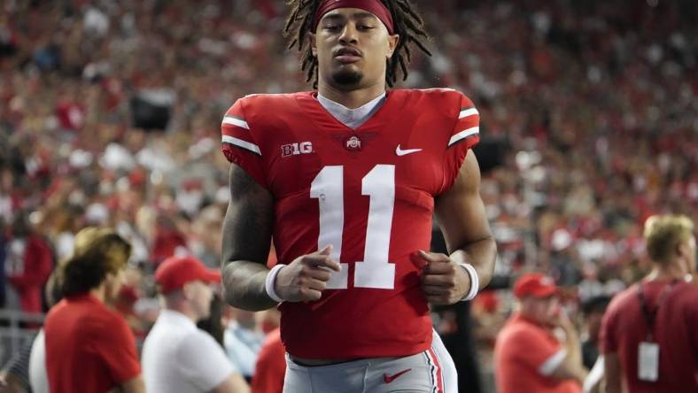 Sep 3, 2022; Columbus, Ohio, USA;  Ohio State Buckeyes wide receiver Jaxon Smith-Njigba (11) runs on the sideline after taking a hard hit during the NCAA football game against the Notre Dame Fighting Irish at Ohio Stadium. Mandatory Credit: Adam Cairns-USA TODAY Sports