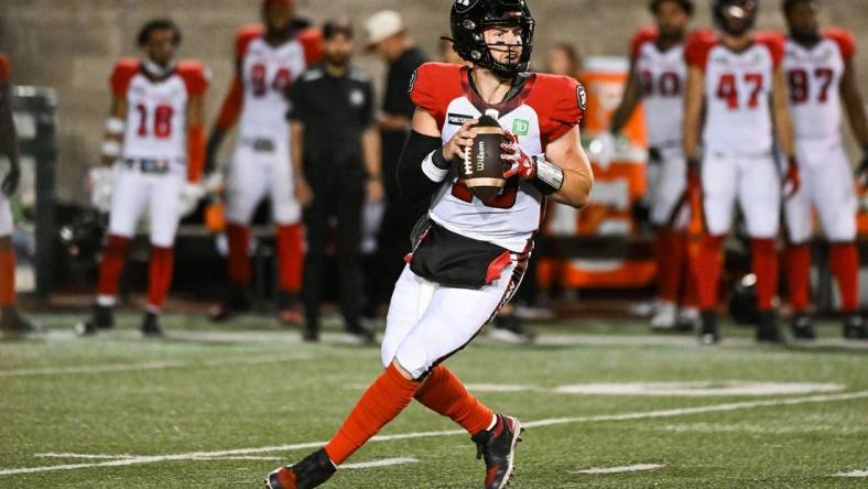 Sep 2, 2022; Montreal, Quebec, CAN; Ottawa Redblacks quarterback Nick Arbuckle (19) against the Montreal Alouettes during the first quarter at Percival Molson Memorial Stadium. Mandatory Credit: David Kirouac-USA TODAY Sports