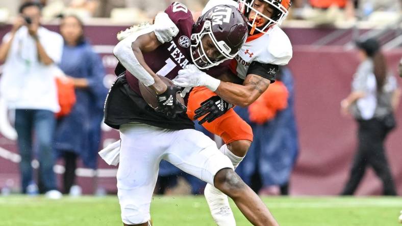 Sep 3, 2022; College Station, Texas, USA;  Texas A&M Aggies wide receiver Chris Marshall (10) is tackled by Sam Houston State Bearkats defensive back Isaiah Downes (4) during the second half at Kyle Field. Mandatory Credit: Maria Lysaker-USA TODAY Sports