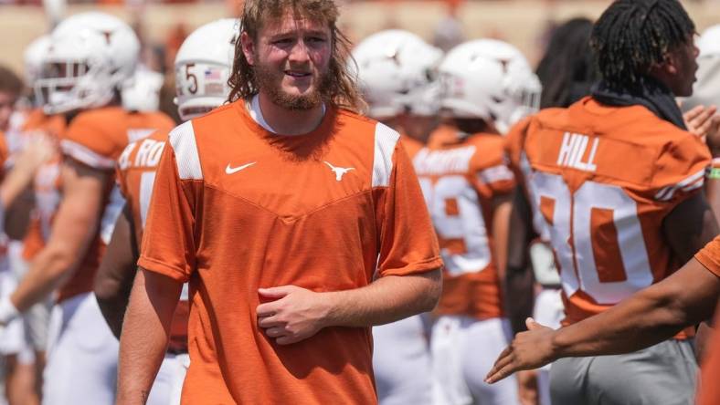 Sep 10, 2022; Austin, TX, USA; Texas quarterback Quinn Ewers walks to the medical tent during the fourth quarter of the loss to Alabama at Darrell K Royal   Texas Memorial Stadium on Saturday September 10, 2022.   Mandatory Credit: Jay Janner/Austin American-Statesman-USA TODAY NETWORK