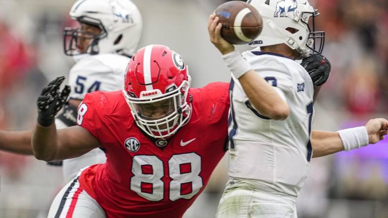 Sep 10, 2022; Athens, Georgia, USA; Georgia Bulldogs defensive lineman Jalen Carter (88) hits Samford Bulldogs quarterback Michael Hiers (10) during the first half at Sanford Stadium. Mandatory Credit: Dale Zanine-USA TODAY Sports