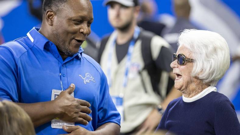 Sep 11, 2022; Detroit, Michigan, USA; Former Detroit Lions Barry Sanders chat with Owner/Chair Emeritus of the Detroit Lions Martha Firestone Ford before the start of the NFL game against the Philadelphia Eagles at Ford Field. Mandatory Credit: David Reginek-USA TODAY Sports