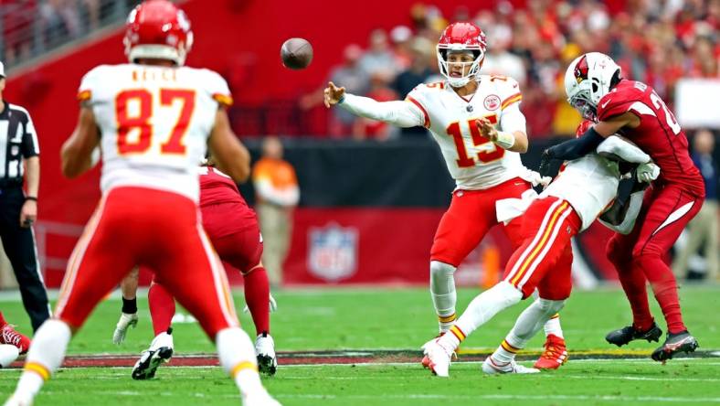 Sep 11, 2022; Glendale, Arizona, USA; Kansas City Chiefs quarterback Patrick Mahomes (15) pass the ball to tight end Travis Kelce (87) during the first half against the Arizona Cardinals at State Farm Stadium. Mandatory Credit: Mark J. Rebilas-USA TODAY Sports