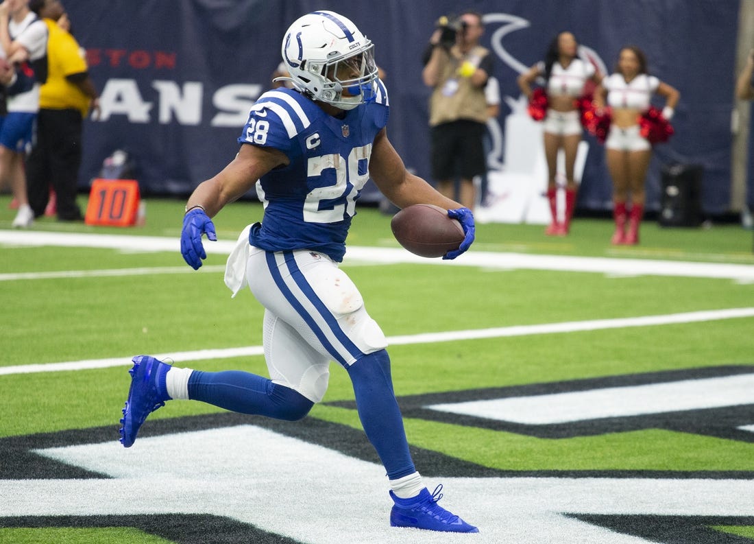 Sep 11, 2022; Houston, Texas, USA;  Indianapolis Colts running back Jonathan Taylor (28) rushes for a touchdown against the Houston Texans in the fourth quarter at NRG Stadium. Mandatory Credit: Thomas Shea-USA TODAY Sports