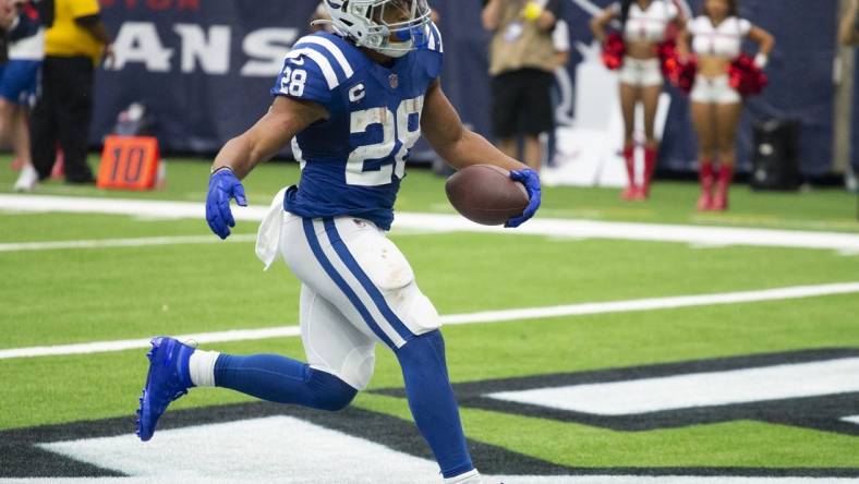 Sep 11, 2022; Houston, Texas, USA;  Indianapolis Colts running back Jonathan Taylor (28) rushes for a touchdown against the Houston Texans in the fourth quarter at NRG Stadium. Mandatory Credit: Thomas Shea-USA TODAY Sports