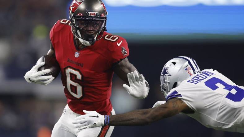 Sep 11, 2022; Arlington, Texas, USA; Tampa Bay Buccaneers wide receiver Julio Jones (6) runs the ball against Dallas Cowboys cornerback Anthony Brown (3) in the second quarter at AT&T Stadium. Mandatory Credit: Tim Heitman-USA TODAY Sports