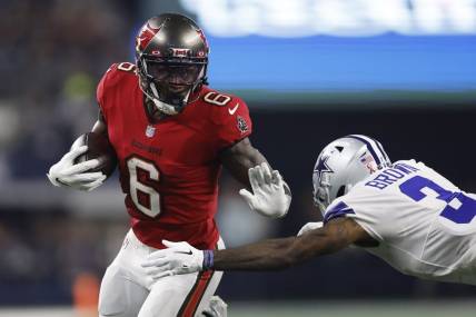 Sep 11, 2022; Arlington, Texas, USA; Tampa Bay Buccaneers wide receiver Julio Jones (6) runs the ball against Dallas Cowboys cornerback Anthony Brown (3) in the second quarter at AT&T Stadium. Mandatory Credit: Tim Heitman-USA TODAY Sports