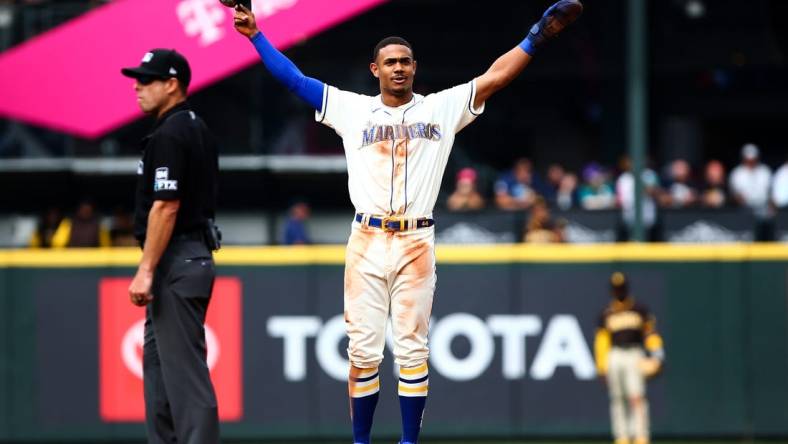 Sep 14, 2022; Seattle, Washington, USA;  Seattle Mariners center fielder Julio Rodriguez (44) acknowledges the crowd after stealing second base to reach 25 home runs and 25 stolen bases for the year at T-Mobile Park. Mandatory Credit: Lindsey Wasson-USA TODAY Sports