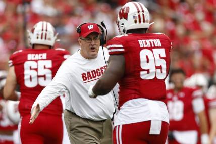 Sep 17, 2022; Madison, Wisconsin, USA;  Wisconsin Badgers head coach Paul Chryst celebrates following a touchdown during the first quarter against the New Mexico State Aggies at Camp Randall Stadium. Mandatory Credit: Jeff Hanisch-USA TODAY Sports
