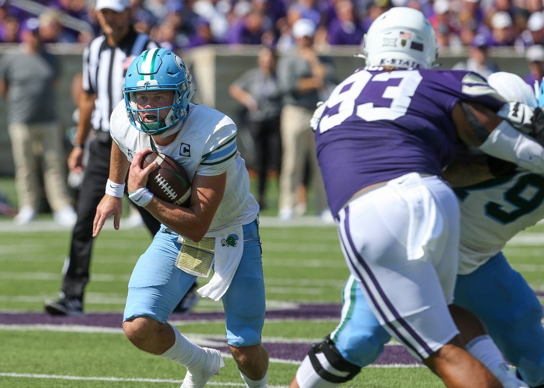 Sep 17, 2022; Manhattan, Kansas, USA; Tulane Green Wave quarterback Michael Pratt (7) runs by Kansas State Wildcats defensive end Jaylen Pickle (93) during the first quarter at Bill Snyder Family Football Stadium. Mandatory Credit: Scott Sewell-USA TODAY Sports