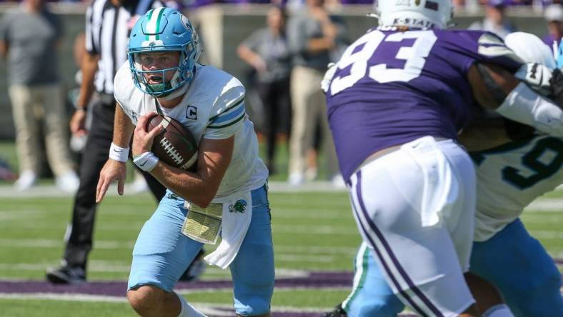 Sep 17, 2022; Manhattan, Kansas, USA; Tulane Green Wave quarterback Michael Pratt (7) runs by Kansas State Wildcats defensive end Jaylen Pickle (93) during the first quarter at Bill Snyder Family Football Stadium. Mandatory Credit: Scott Sewell-USA TODAY Sports