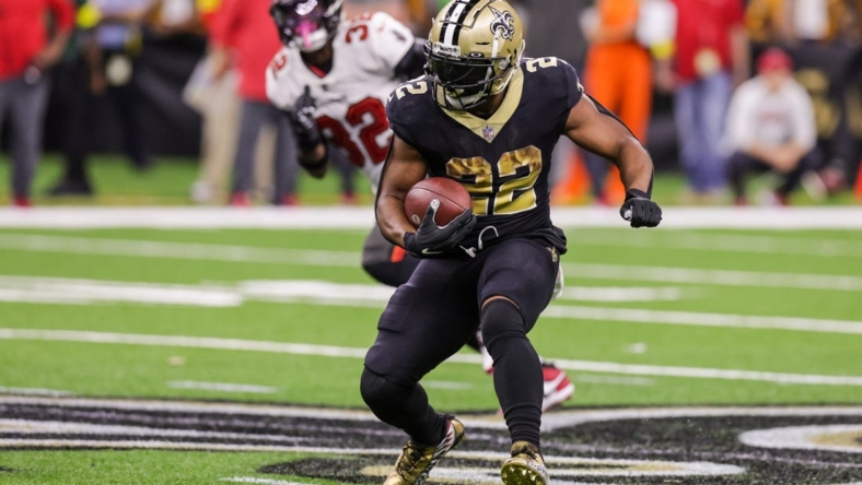 Sep 18, 2022; New Orleans, Louisiana, USA;  New Orleans Saints running back Mark Ingram II (22) rushes against Tampa Bay Buccaneers safety Mike Edwards (32) during the second half at Caesars Superdome. Mandatory Credit: Stephen Lew-USA TODAY Sports
