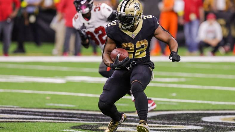 Sep 18, 2022; New Orleans, Louisiana, USA;  New Orleans Saints running back Mark Ingram II (22) rushes against 
Tampa Bay Buccaneers safety Mike Edwards (32) during the second half at Caesars Superdome. Mandatory Credit: Stephen Lew-USA TODAY Sports