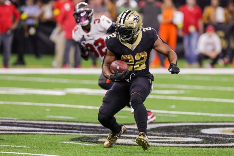 Sep 18, 2022; New Orleans, Louisiana, USA;  New Orleans Saints running back Mark Ingram II (22) rushes against 
Tampa Bay Buccaneers safety Mike Edwards (32) during the second half at Caesars Superdome. Mandatory Credit: Stephen Lew-USA TODAY Sports
