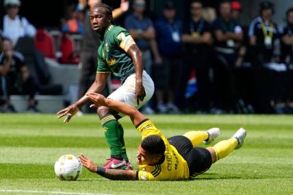 Sep 18, 2022; Columbus, Ohio, USA; Columbus Crew forward Cucho Hernandez (9) is fouled by Portland Timbers midfielder Diego Chara (21) during the first half of the MLS game at Lower.com Field. Mandatory Credit: Adam Cairns-The Columbus Dispatch

Mls Portland Timbers At Columbus Crew