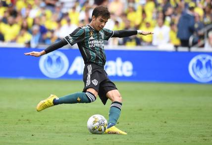Sep 10, 2022; Nashville, Tennessee, USA; Los Angeles Galaxy midfielder Riqui Puig (6) attempts a shot during the first half against the Nashville SC at Geodis Park. Mandatory Credit: Christopher Hanewinckel-USA TODAY Sports