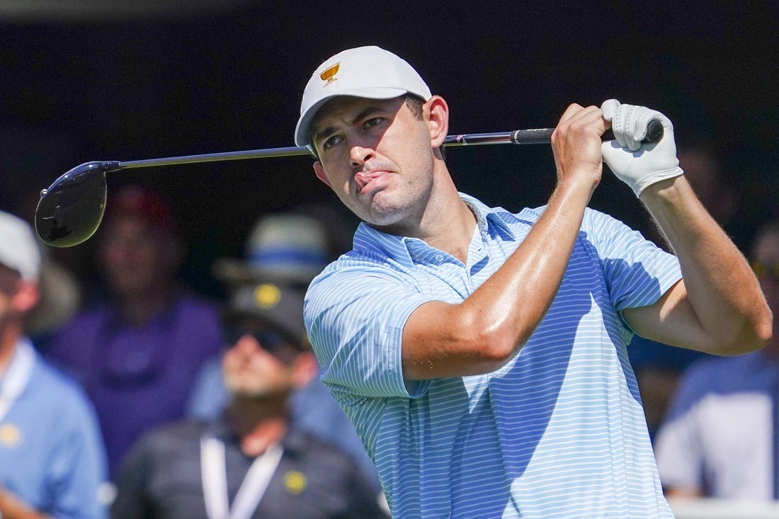 Sep 22, 2022; Charlotte, North Carolina, USA; Team USA golfer Patrick Cantlay hits his tee shot on the first hole during the foursomes match play of the Presidents Cup golf tournament at Quail Hollow Club. Mandatory Credit: Peter Casey-USA TODAY Sports