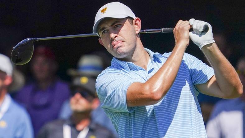 Sep 22, 2022; Charlotte, North Carolina, USA; Team USA golfer Patrick Cantlay hits his tee shot on the first hole during the foursomes match play of the Presidents Cup golf tournament at Quail Hollow Club. Mandatory Credit: Peter Casey-USA TODAY Sports