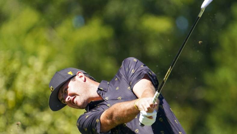 Sep 23, 2022; Charlotte, North Carolina, USA; International Team golfer Mito Pereira celebrates hits his tee shot on the fourth hole during the four-ball match play of the Presidents Cup golf tournament at Quail Hollow Club. Mandatory Credit: Peter Casey-USA TODAY Sports