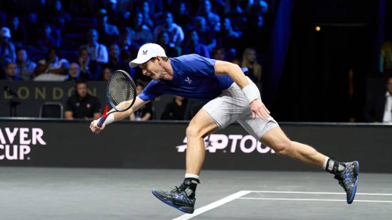 Sep 23, 2022; London, United Kingdom;  Andy Murray (GBR) plays a shot against Alex De Minaur (AUS) in his Laver Cup tennis match.  Mandatory Credit: Peter van den Berg-USA TODAY Sports